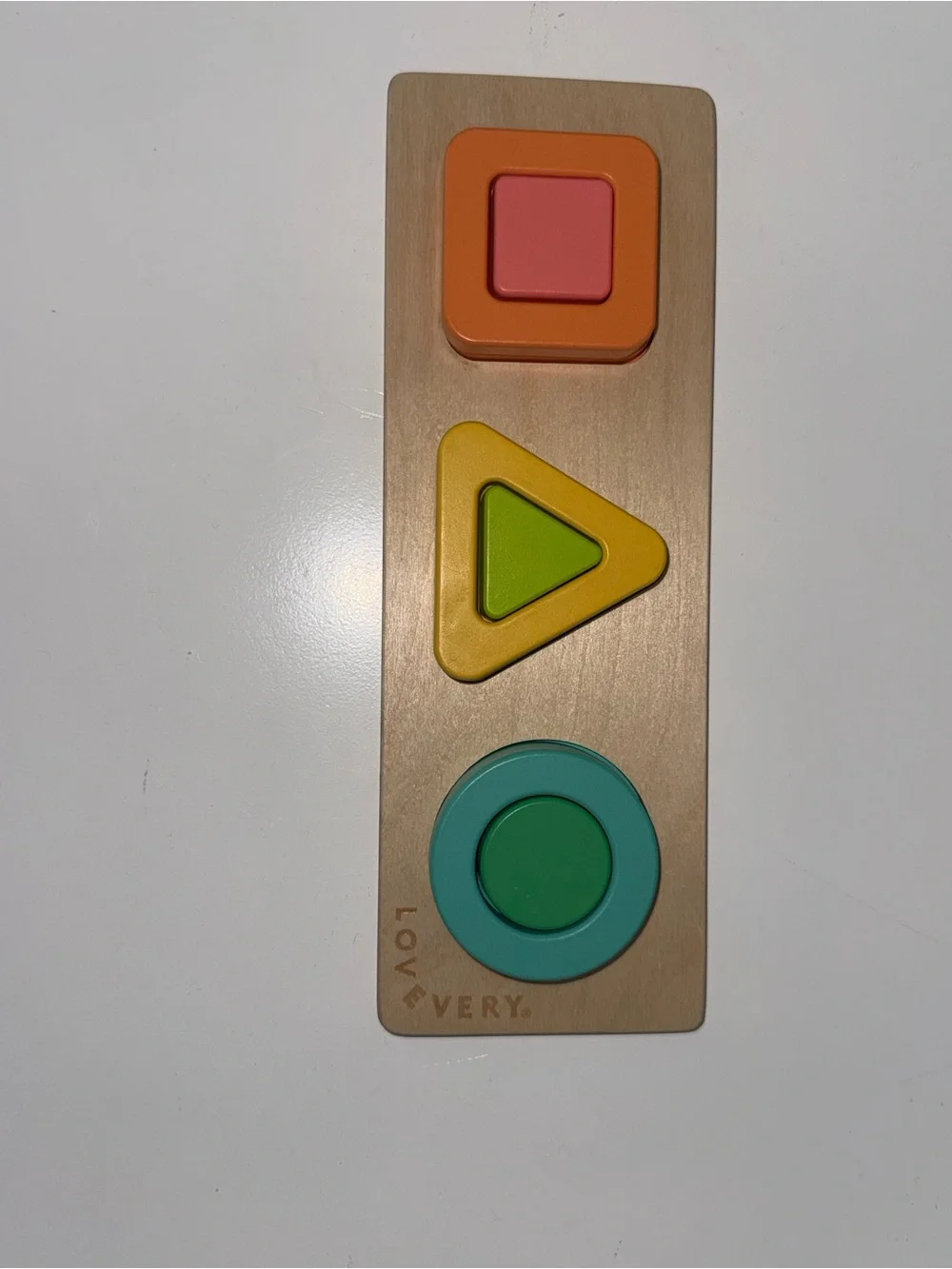Lovevery Wooden Shape & Stack Toy Set in Green, Yellow, Blue, Orange, Pink